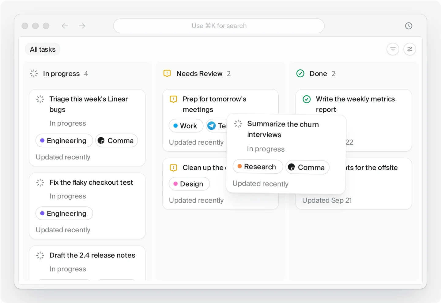 Comma's official task board demo shows three labeled columns: In progress, Needs Review, and Done, with example work cards in each.
